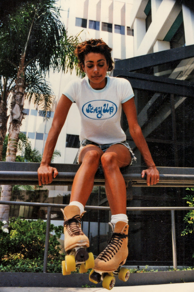Stay Up model on skates wearing a Stay Up t-shirt — lifestyle apparel for motivation and resilience